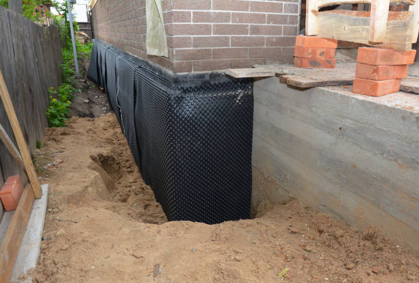 Happy homeowners after waterproofing job in Upper Black Eddy